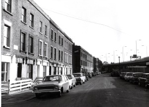 looking eastward along Walmer Road from the junction with Pamber Street showing the three remaining blocks facing the new road. No77 is one from the far end of the middle block. Bill Kirkhams Vauxhall Cresta is the 3rd car on the left close to the junction with Aldermaston Street