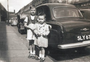Me with Con on the left, about 1956 outside number 89 with the knitwear factory in the background, looking towards the junction with Golborne Road 